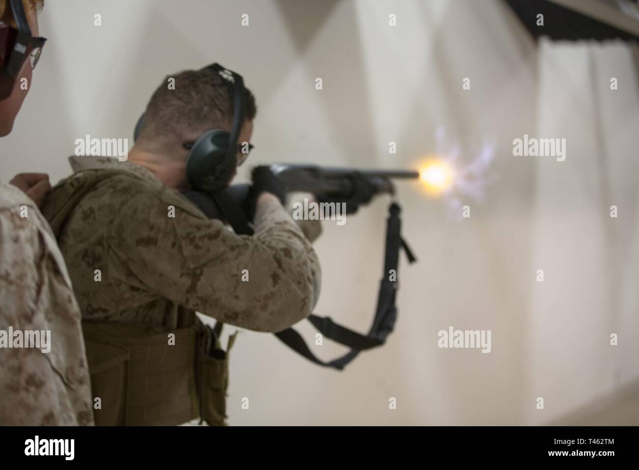 NAVAL SUPPORT ACTIVITY BAHRAIN (Feb. 28, 2019) A U.S. Marine with Fleet Anti-terrorism Security Team, Central Command fires an M500 shotgun at a target during a live-fire sustainment training range. FASTCENT provides expeditionary anti-terrorism and security forces to embassies, consulates and other vital national assets throughout the U.S. Central Command area of responsibility. Stock Photo