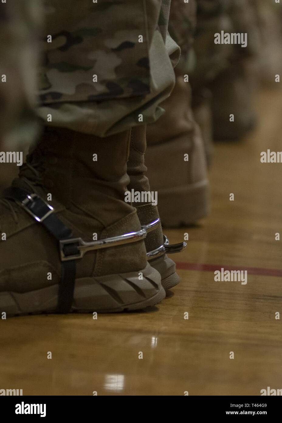 A soldier wears spurs during a ceremony for 4th Combat