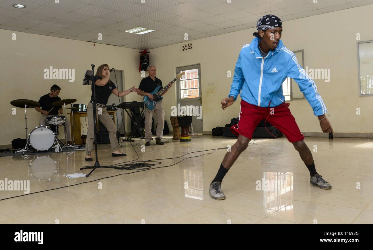 A Student Dances To Music Played By The U S Air Forces In Europe Band Touch N Go During A Performance At The Gisimba Memorial Centre In Kigali Rwanda March 6 2019 As