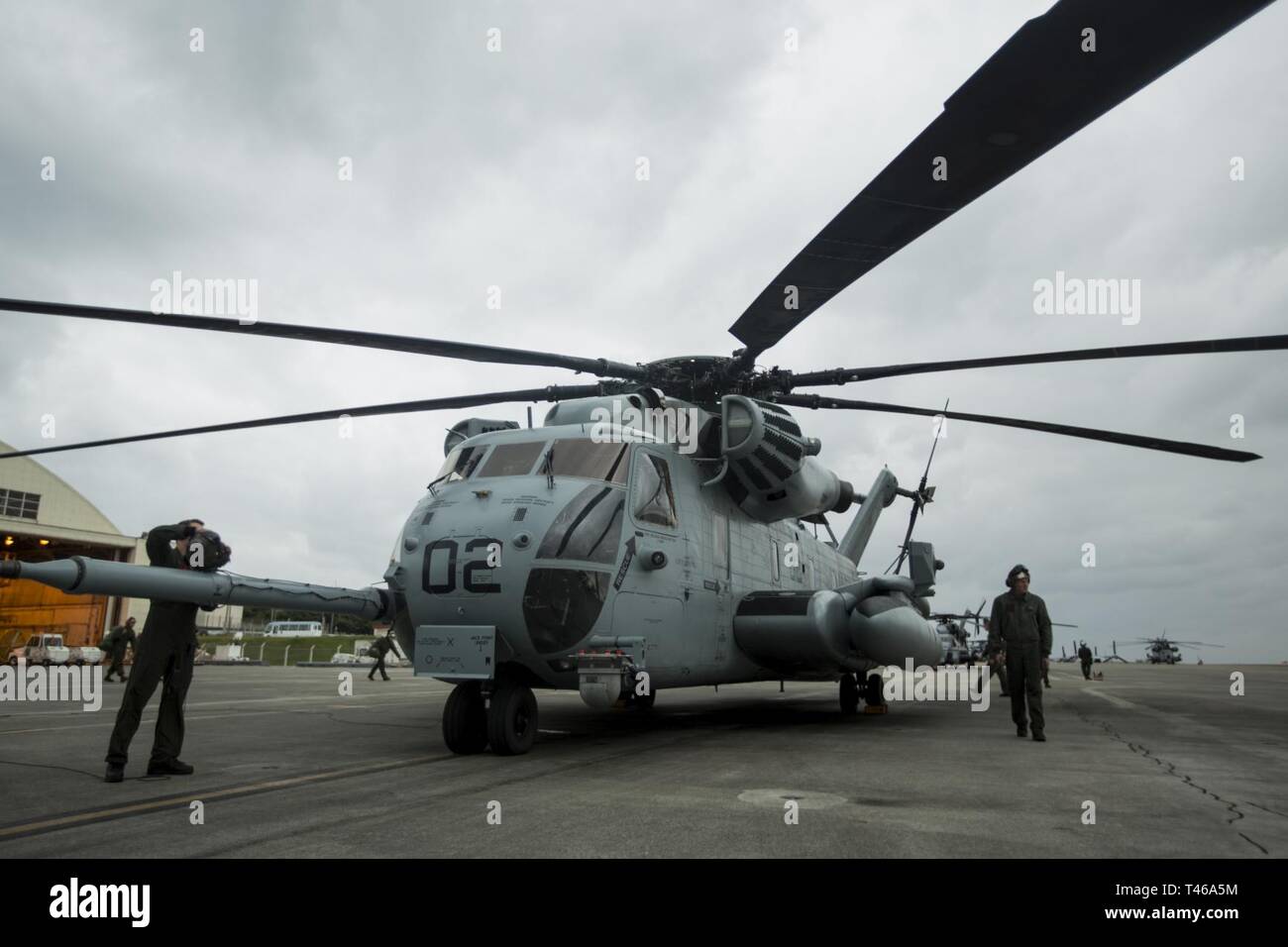 A U.S. Marine Corps CH-53 Super Stallion helicopter, assigned to Marine Heavy Helicopter Squadron 465, prepares for take-off from the flight line of Marine Corps Air Station Futenma, Okinawa, Japan, Mar. 7, 2019. This aircraft underwent a combined Planned Maintenance Interval (PMI) and H-53 Reset event at Fleet Readiness Center Western Pacific. Combining the CH-53E PMI and reset events greatly reduces the amount of time a CH-53E spends out of service allowing the aircraft to be available for operational commitments. Stock Photo