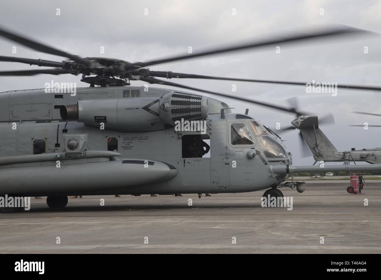 A U.S. Marine Corps CH-53 Super Stallion helicopter, assigned to Marine Heavy Helicopter Squadron 465, prepares for take off from the flight line of Marine Corps Air Station Futenma, Okinawa, Japan, Mar. 7, 2019. This aircraft underwent a combined Planned Maintenance Interval (PMI) and H-53 Reset event at Fleet Readiness Center Western Pacific. Combining the CH-53E PMI and reset events greatly reduces the amount of time a CH-53E spends out of service allowing the aircraft to be available for operational commitments. Stock Photo