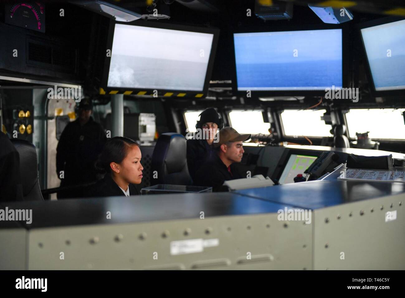 PACIFIC OCEAN (Mar 11, 2019) Sailors stand watch on the bridge ...