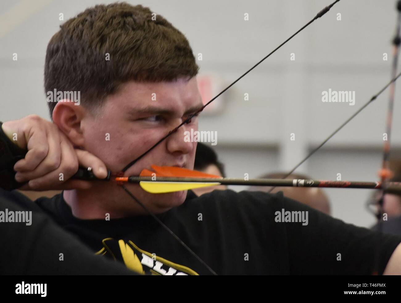 Staff Sgt. Kohl McLeod, a wounded warrior athlete from Fort Benning gets ready to shoot a bow at archery practice during the 2019 Army Trials, Mar. 8. The 2019 Army Trials at Fort Bliss, Texas is an adaptive sports competition from Mar. 5-16 with over 100 wounded, ill and injured active-duty Soldiers and veterans competing in 14 different sports for the opportunity to represent Team Army at the 2019 Department of Defense Warrior Games in Tampa, Florida. Stock Photo