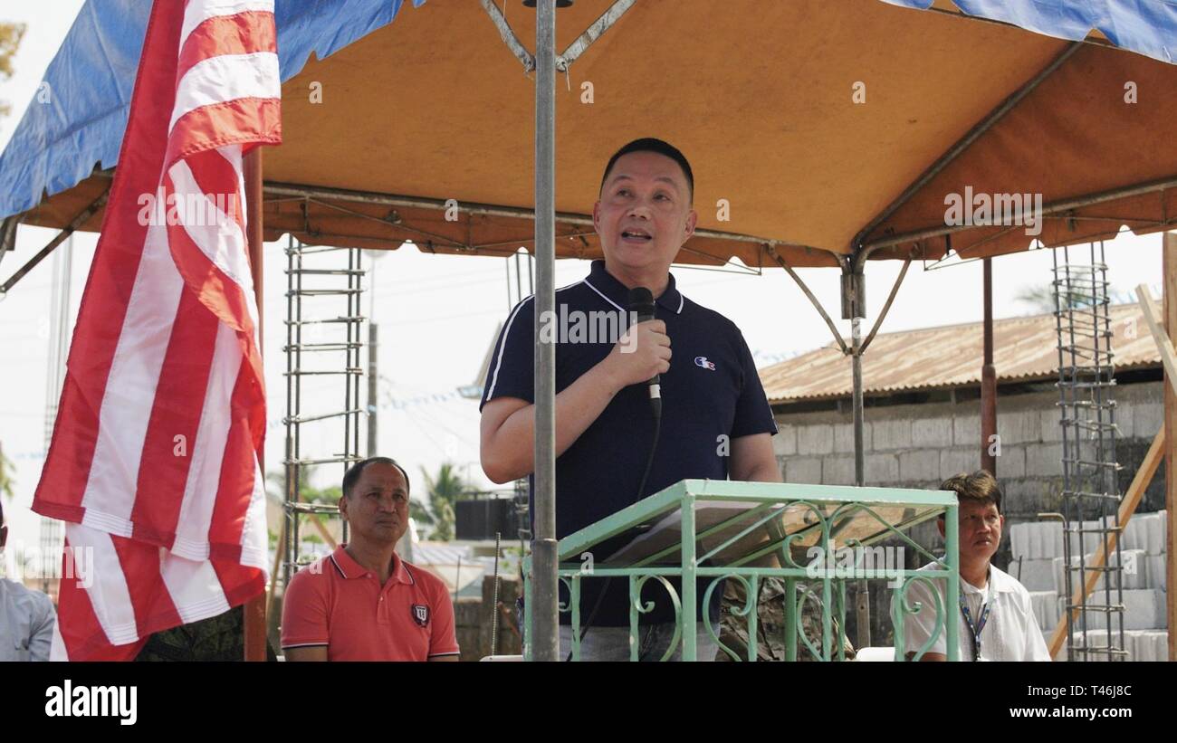 The Honorable Efren Pascual Jr., municipal mayor of Orani, Bataan, delivers remarks during the Engineering Civic Action Project 4 opening ceremony as part of Exercise Balikatan, March 12, 2019. During the exercise planning process, military planners visited various locations in coordination with Armed Forces of the Philippines and local officials to nominate sites. Numerous factors were taken into account, including logistics requirements, unit capabilities, and exercise requirements. Pagasa Elementary School was selected as one of the Balikatan construction projects following this selection p Stock Photo