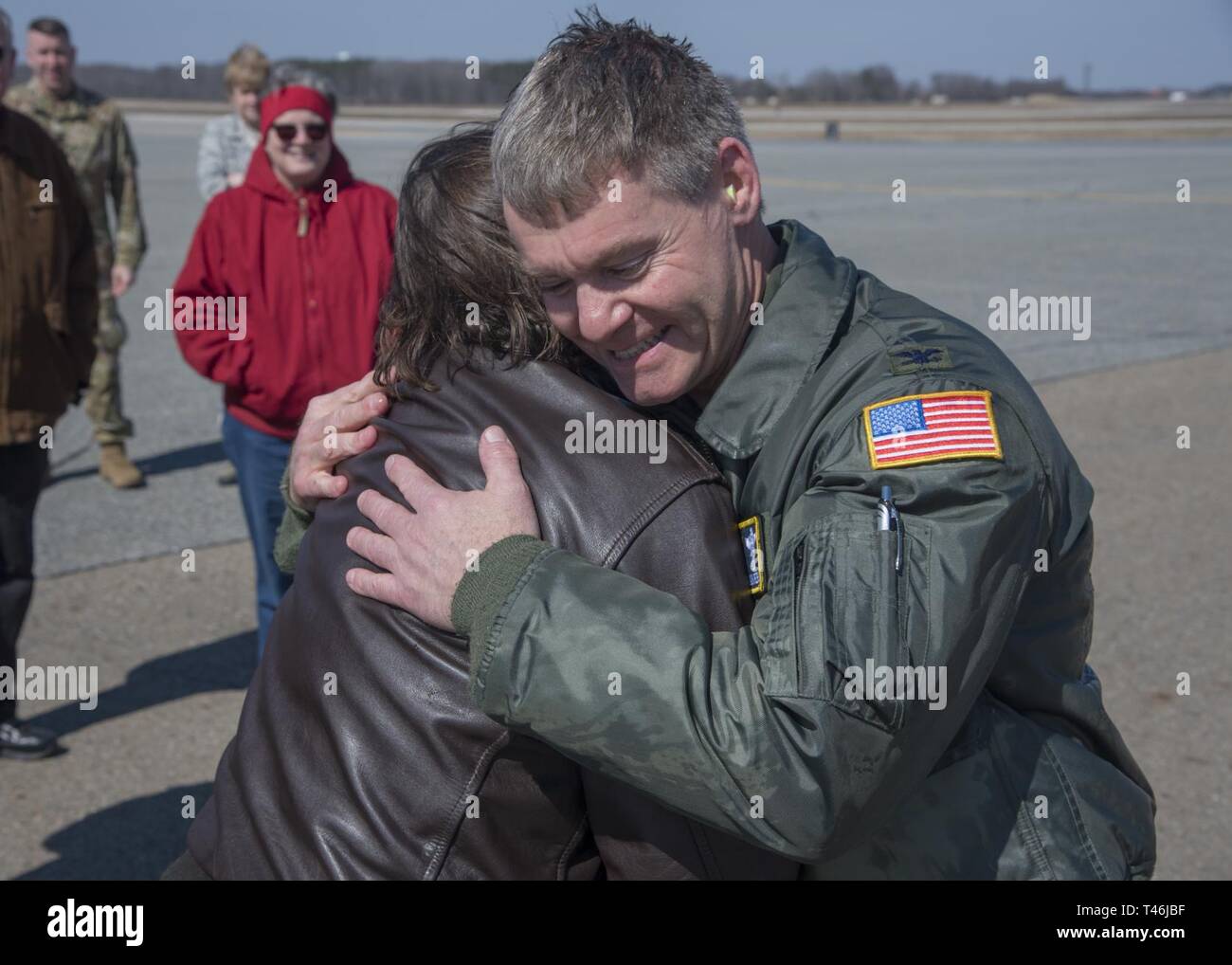 Chief Master Sgt. Amy Campbell, 326th Airlift Squadron loadmaster superintendent, embraces Col. Craig C. Peters, 512th Airlift Wing commander, during his fini flight celebration March 12, 2019, at Dover Air Force Base, Delaware. The 326th AS is the only Air Force Reserve squadron on base that operates the C-17 Globemaster III. Stock Photo