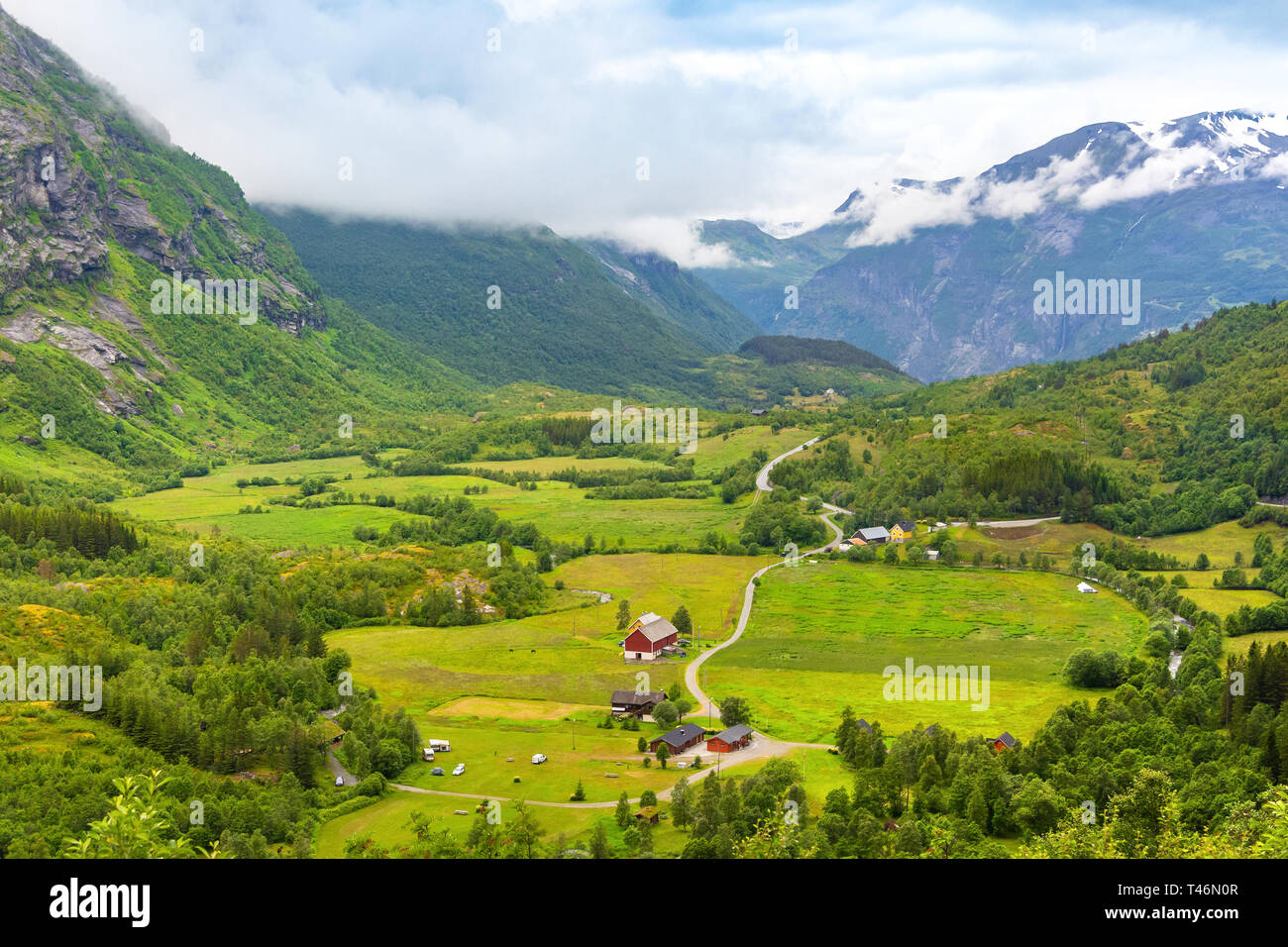 Traditional colored wooden house in Norway at summer day. Country