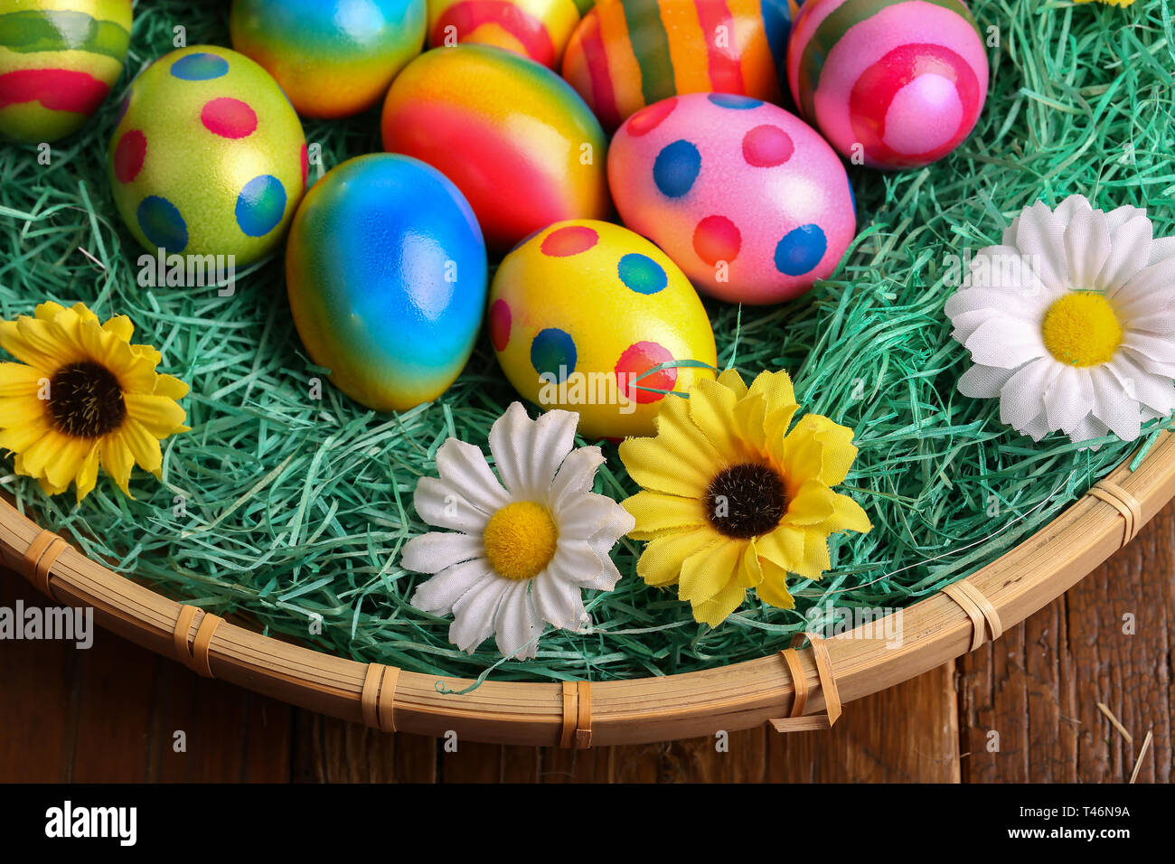 Easter traditions. Compositions with painted Easter eggs. Stock Photo
