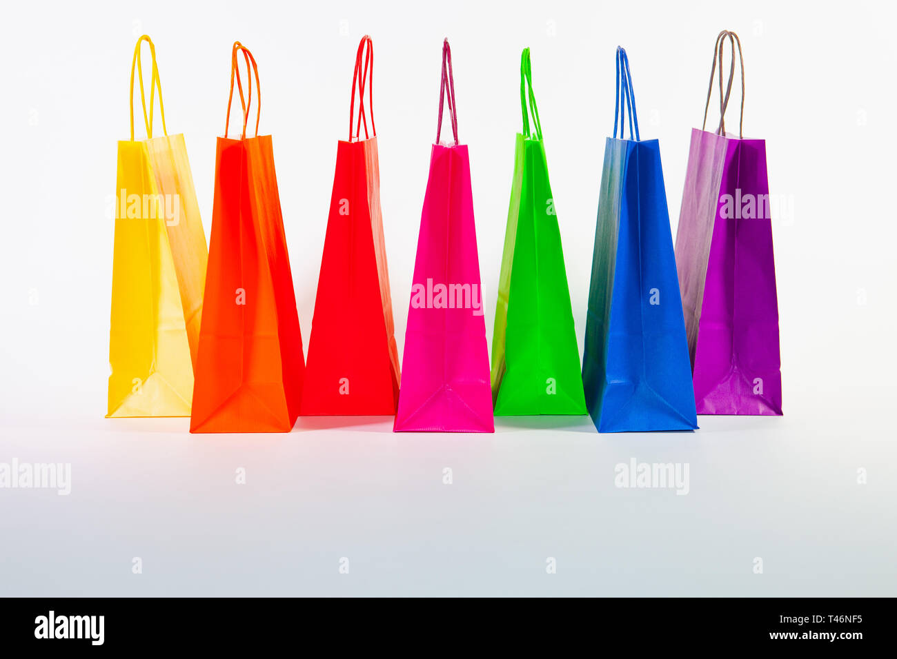Set of colorful empty shopping bags isolated on the white background ...