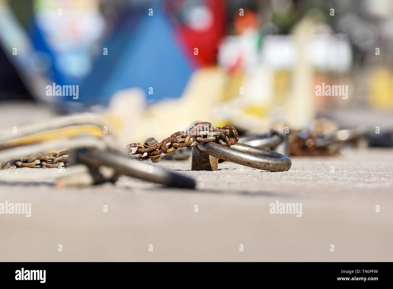 Nautical anchor chain with rust in the pier. Stock Photo