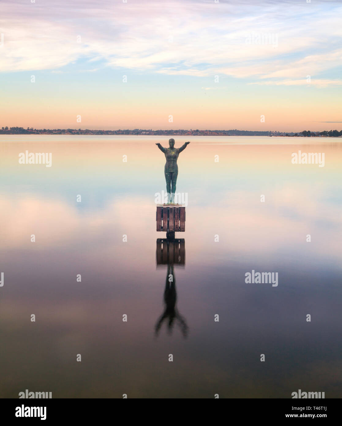 Eliza sculpture in the Swan River at dawn. The bronze sculpture depicts a woman diving off a platform & commemorates the location of Crawley Baths Stock Photo