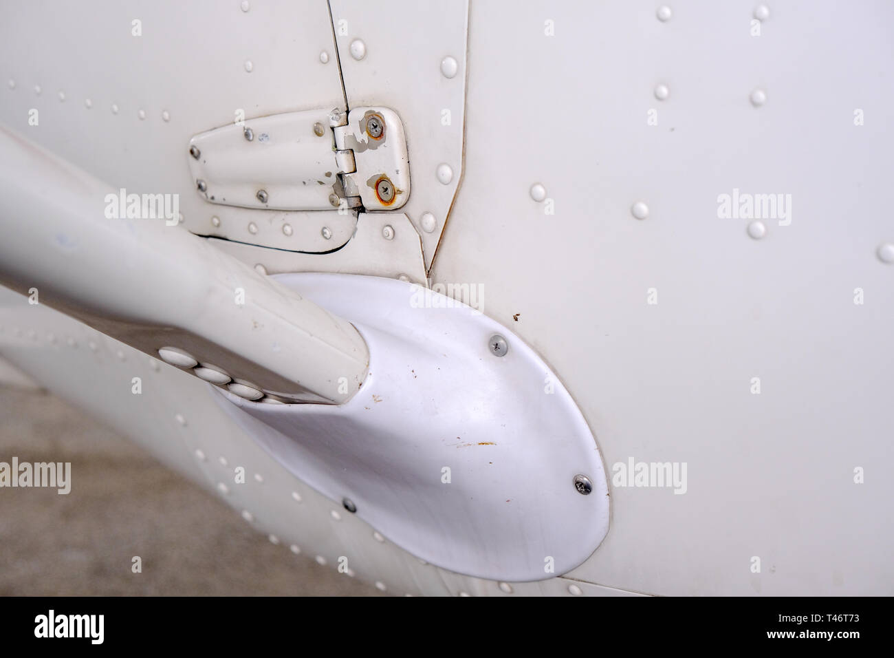 Light sport aircraft wing strut attached to fusselage, close up detail of airframe construction Stock Photo