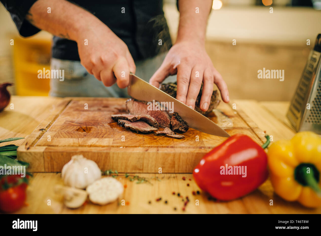 Chef at the pan with roasted meat and vetables Stock Photo - Alamy