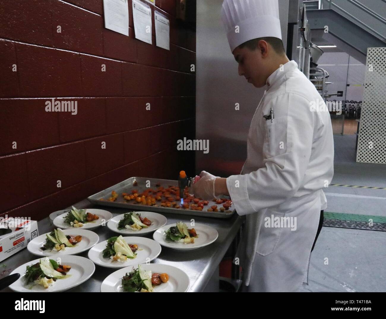 sgt. raul najera, culinary arts specialist, team korea, brulees tomatoes for salads as part of the mobile kitchen trailer hot buffet event march 14 as part of the joint culinary training exercise ( sgt. raul najera, culinary
