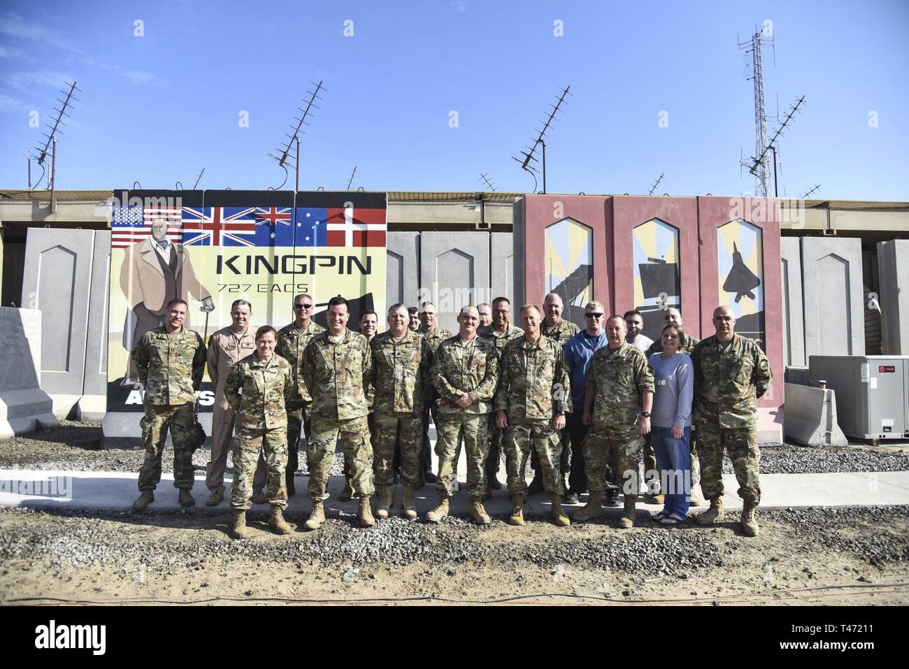 727th Expeditionary Air Control Squadron Airmen, deployed from the Utah Air National Guard, pose for a group photo with UTANG leadership at Al Dhafra Air Base, United Arab Emirates, Mar. 14, 2019. Since September 11, 2001, UTANG members have been activated and deployed for worldwide duty to include Operations Noble Eagle, Enduring Freedom and Iraqi Freedom. Stock Photo