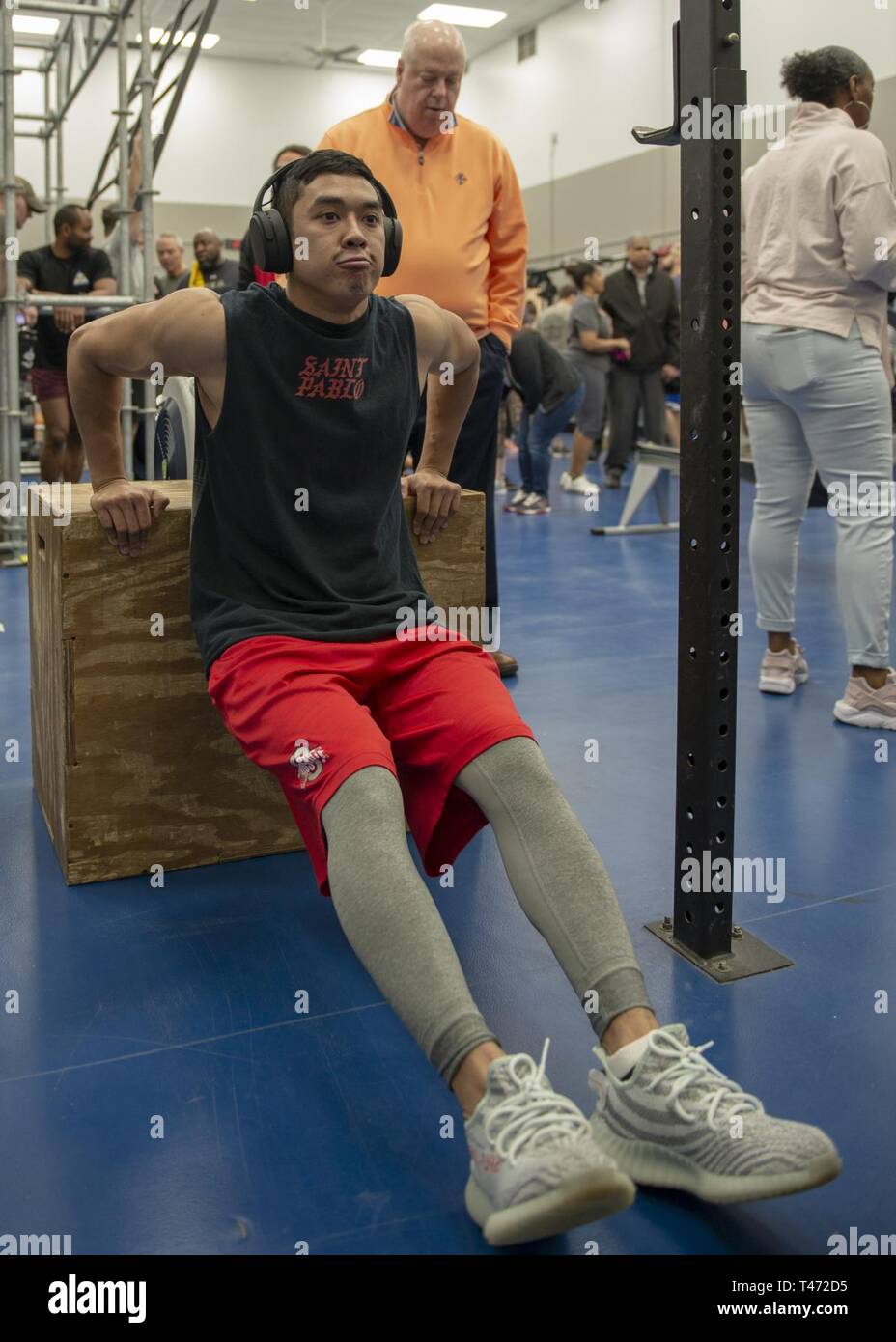 Airman 1st Class Thino Chandara, 375th Force Support Squadron fitness  apprentice, performs a dip on a box as a part of the 13th annual Maltz  Challenge, March 15, 2019, at Scott Air