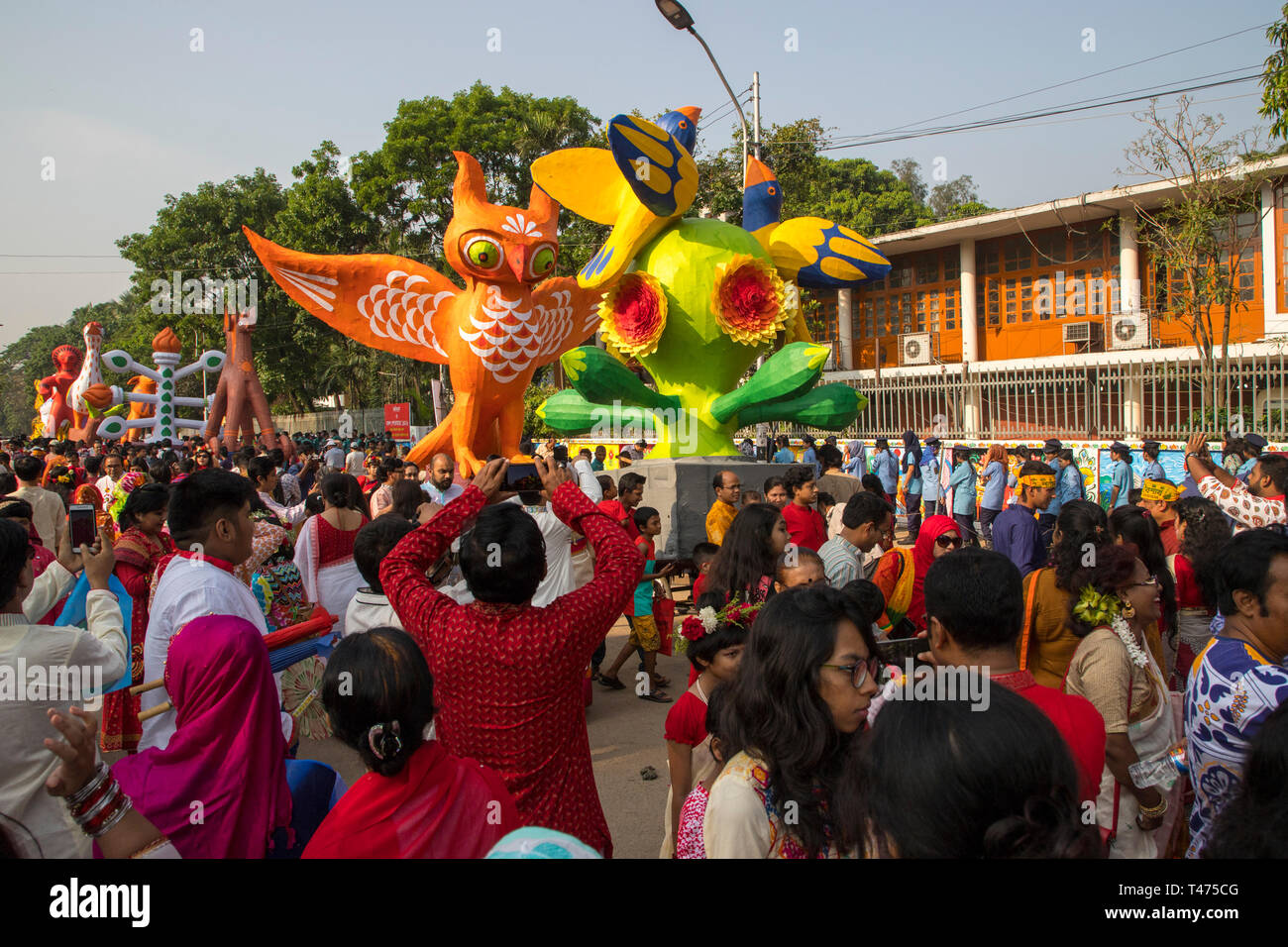 Dhaka, Bangladesh. 14th Apr, 2019. Mangal Shobhajatra, a colourful and festive procession celebrating Pahela Baishakh, the Bangala New Year, sets off  Stock Photo