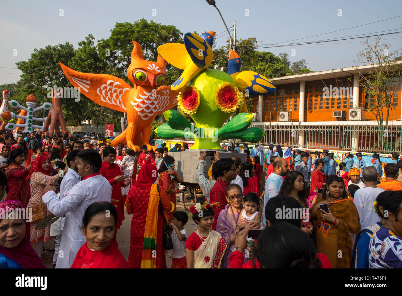 Dhaka, Bangladesh. 14th Apr, 2019. Mangal Shobhajatra, a colourful and festive procession celebrating Pahela Baishakh, the Bangala New Year, sets off  Stock Photo