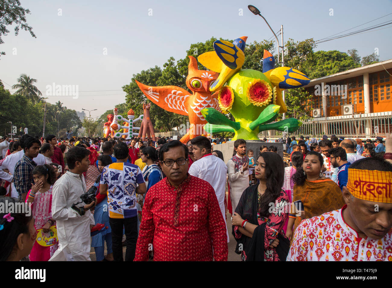Dhaka, Bangladesh. 14th Apr, 2019. Mangal Shobhajatra, a colourful and festive procession celebrating Pahela Baishakh, the Bangala New Year, sets off  Stock Photo