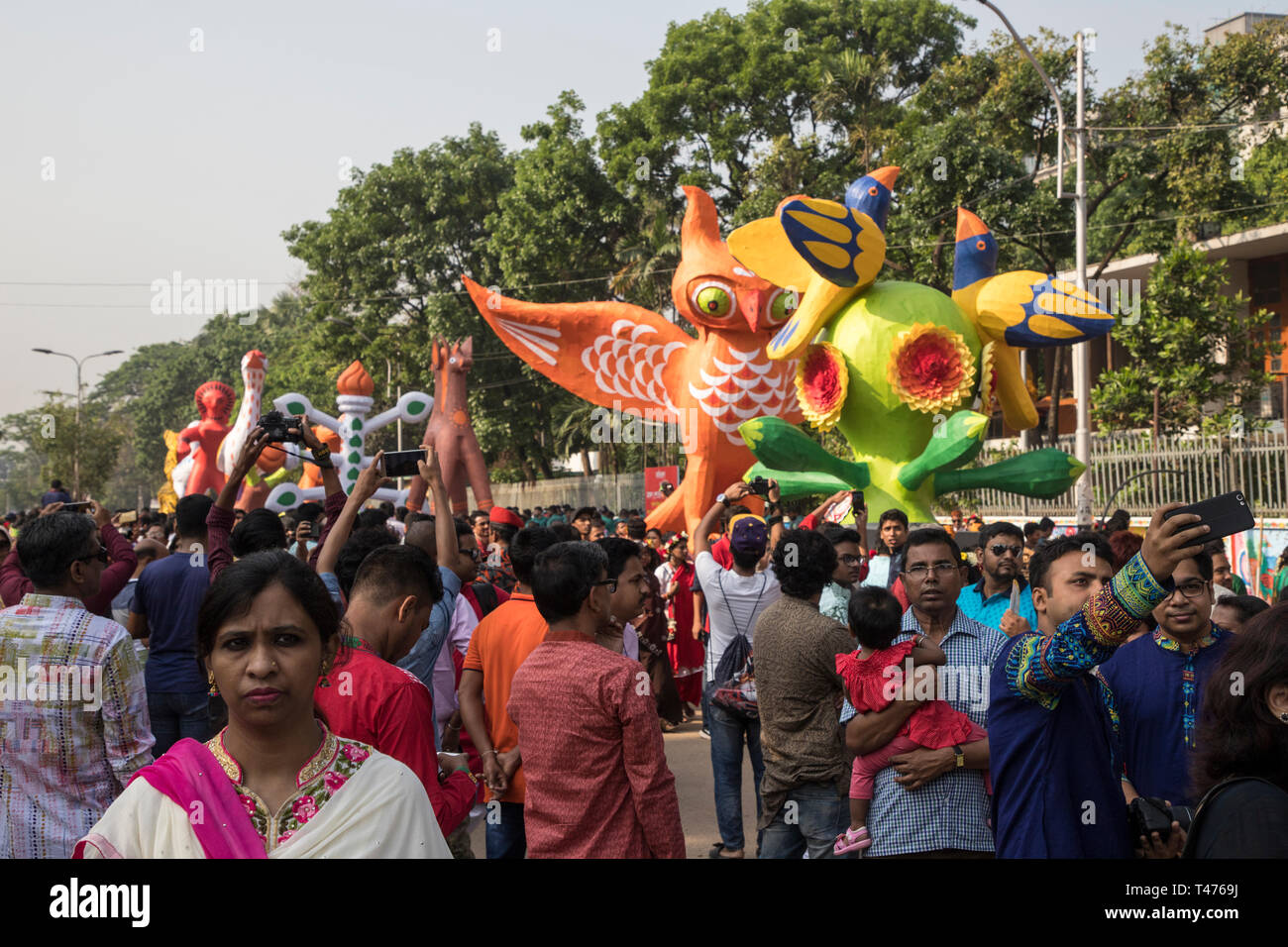 Dhaka, Bangladesh. 14th Apr, 2019. Mangal Shobhajatra, a colourful and festive procession celebrating Pahela Baishakh, the Bangala New Year, sets off  Stock Photo