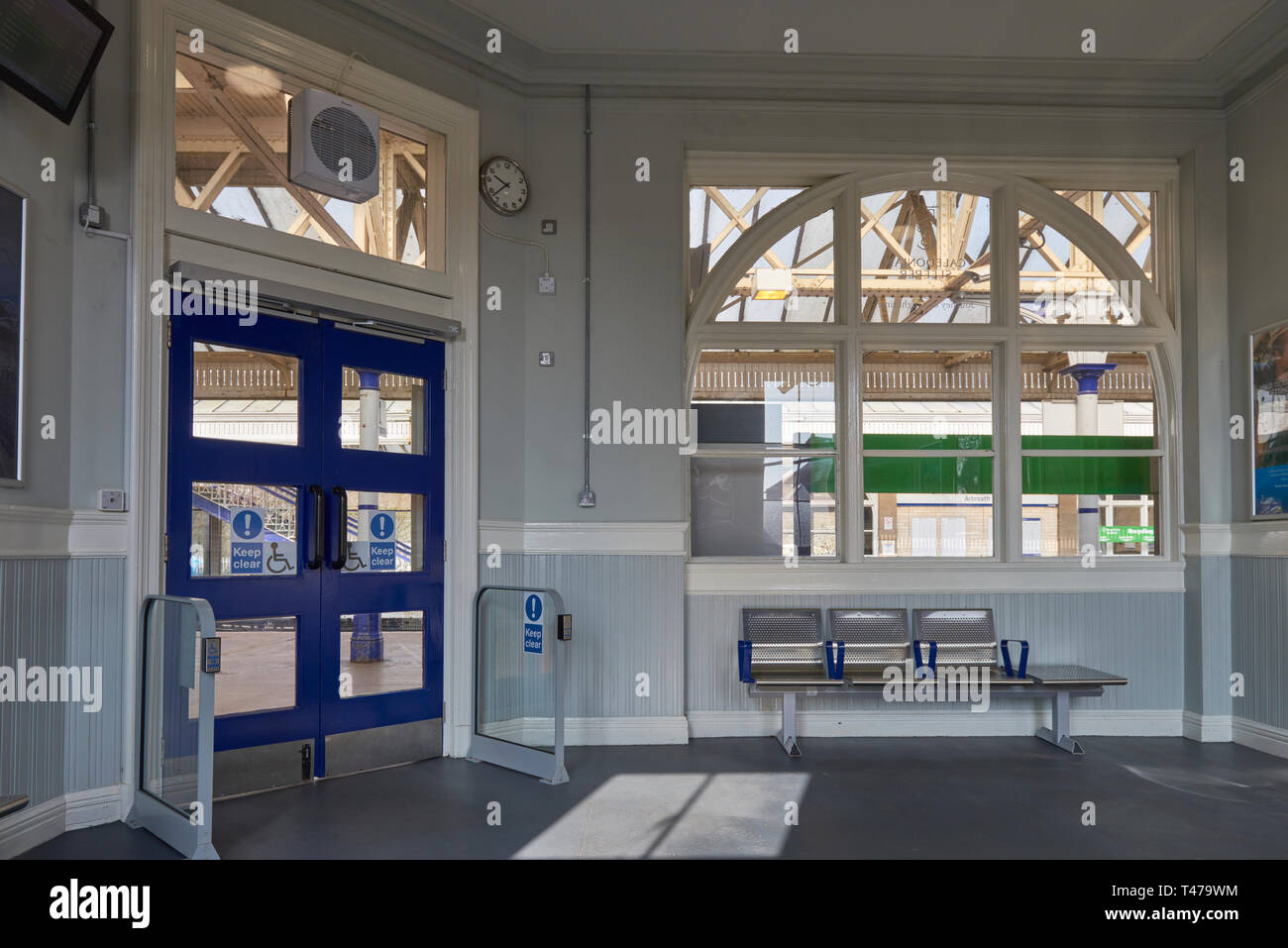 The Waiting Room at Arbroath Station on one Spring Day in April, with its stainless steel seating and disability friendly automatic doors. Angus, Scot Stock Photo