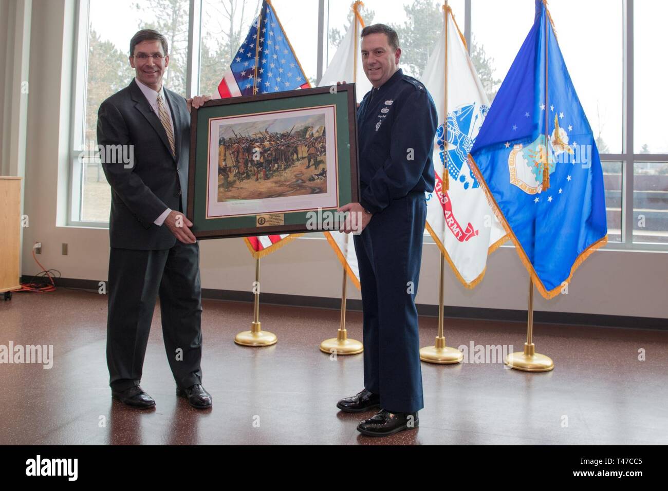 HANSCOM AIR FORCE BASE, Mass. – Dr. Mark T. Esper, Secretary of the Army, joins Maj. Gen. Gary W. Keefe, the Adjutant General of the Massachusetts National Guard and other senior leadership during a visit to Joint Force Headquarters of the Massachusetts National Guard, here, March 15, 2019. After an awards ceremony held to recognize soldiers and civilians of the Massachusetts Army National Guard, Esper held a town hall to communicate and connect with the soldiers and airmen of the Commonwealth. Stock Photo