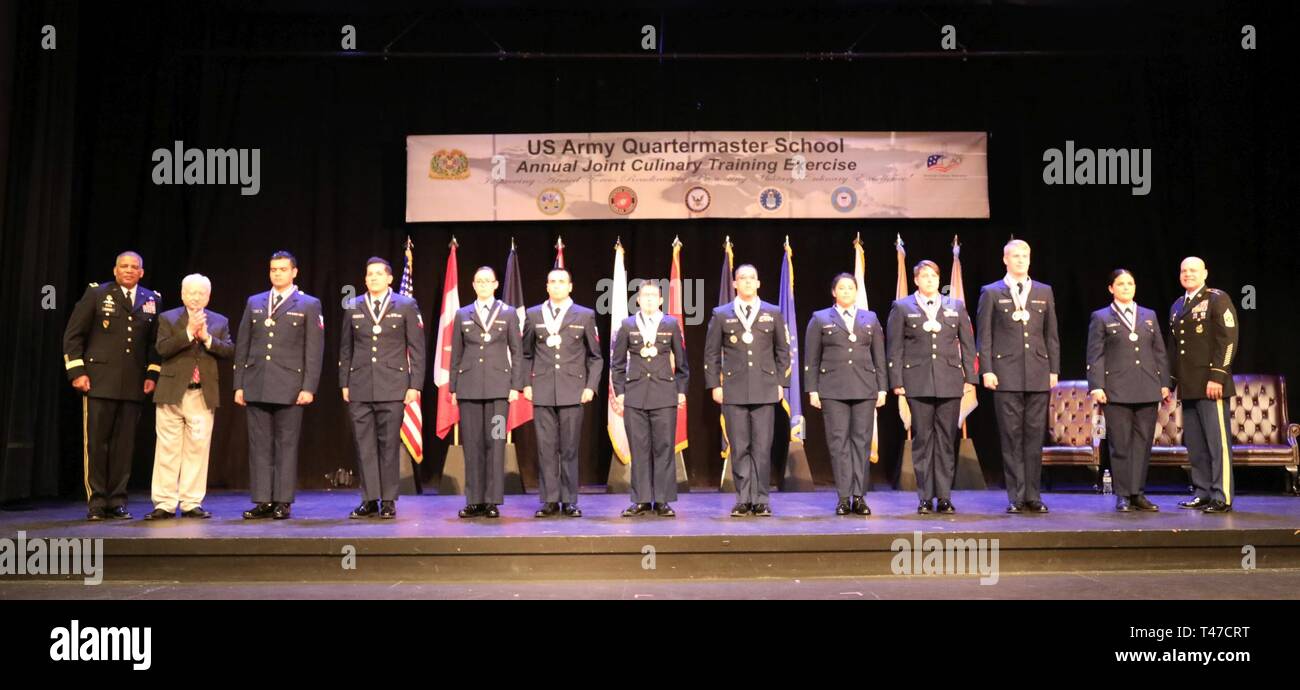 U.S. Coast Guard medal winners with Brig. Gen. Douglas McBride, Quartermaster General, American Culinary Federation lead judge Roland Schaeffer, and Quartermaster Regimental Command Sgt. Maj. Eric Vidal at the awards ceremony March 15 as part of the Joint Culinary Training Exercise (JCTE) at Fort Lee, Va. The 44th annual JCTE officially started March 9 at MacLaughlin Fitness Center and continued until March 14. The exercise, administered by the Joint Culinary Center of Excellence, is the largest American Culinary Federation-sanctioned competition in North America. The exercise showcased the ta Stock Photo