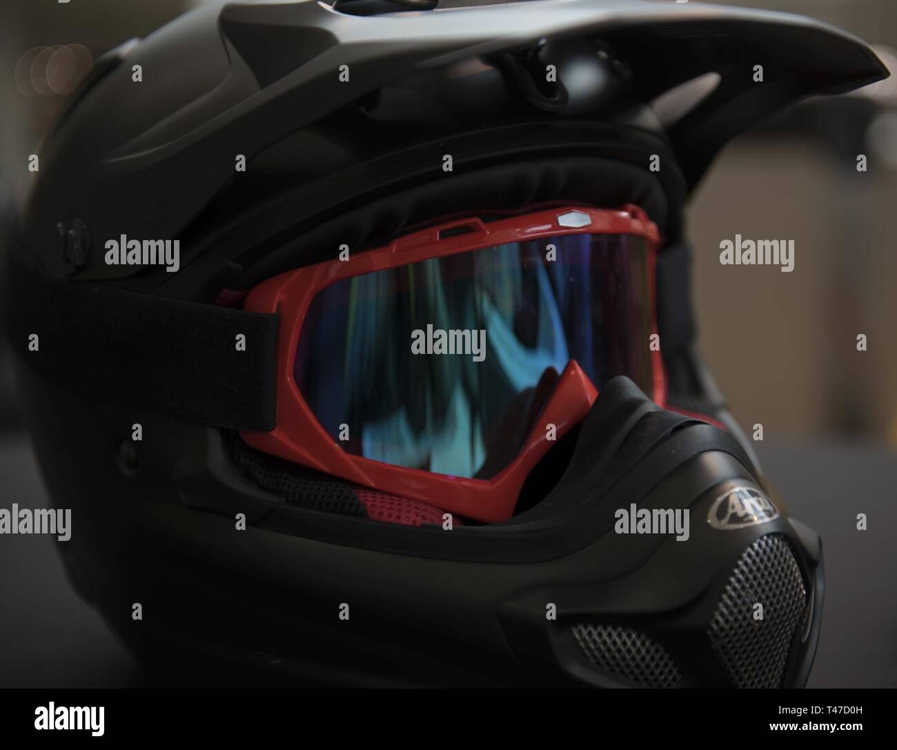 A motorcycle helmet sits on display for riders attending the 86th Airlift Wing annual pre-season motorcycle safety briefing at the Kaiserslautern Military Community Center on Ramstein Air Base, Germany, March 15, 2019. The briefing covered safety precautions, German road laws, proper protective gear to wear while riding, and testimonies from guest speakers. ( U.S. Air Force Stock Photo