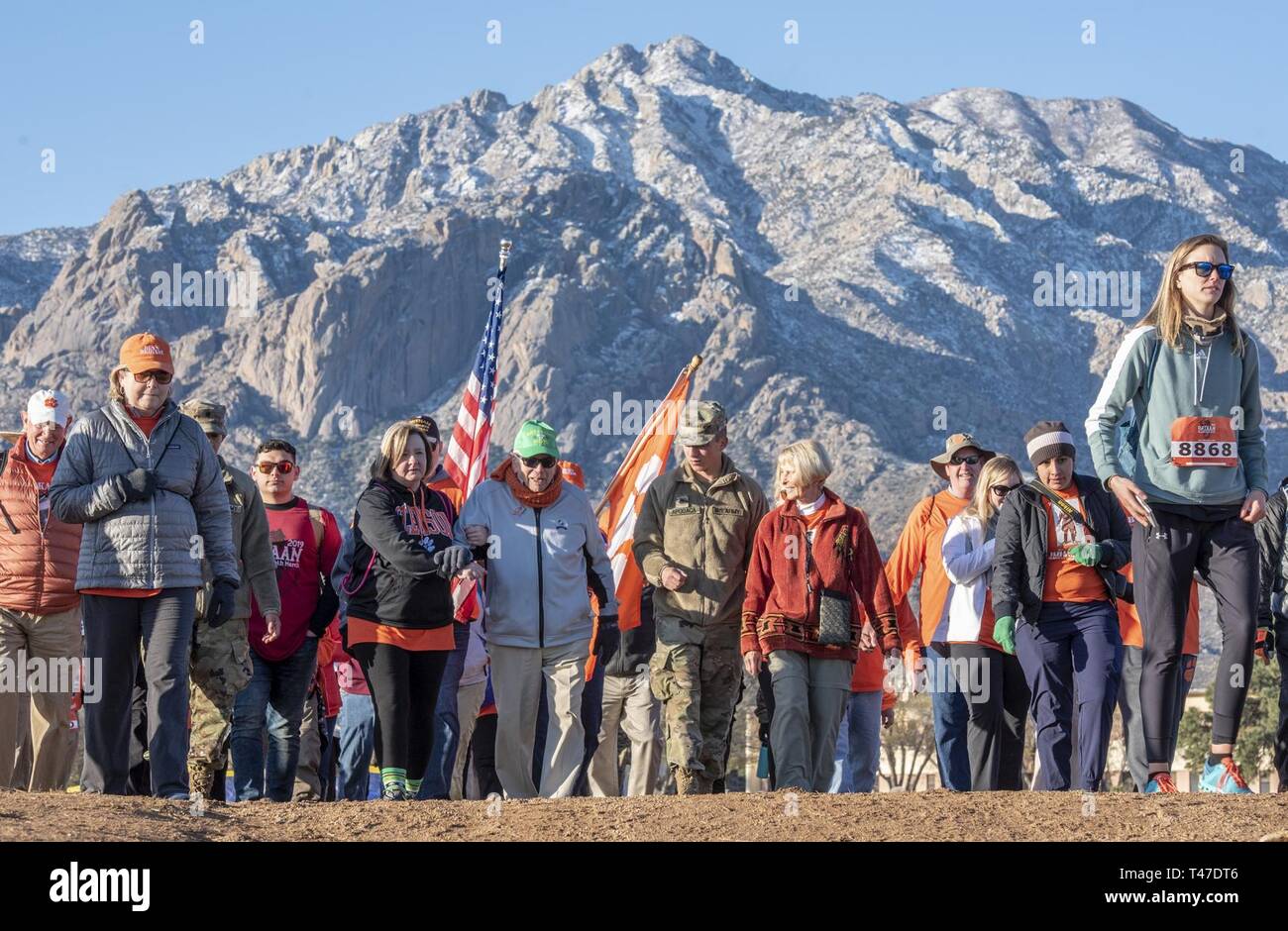 Col. Ben Skardon, a 1938 graduate of Clemson University, WWII POW, recipient of two Silver Stars, and survivor of the Bataan Death March, walks in the Bataan Memorial Death March at White Sands Missile Range, N.M. March 17, 2019. He is 101 years old, and the only survivor of the actual death march to walk in the memorial march. After he retired from the Army, he came back to Clemson and taught English until his retirement in 1982. A group of his former students, family members, ROTC cadets, and relatives of men he served with called 'Ben's Brigade' walk with him. Stock Photo