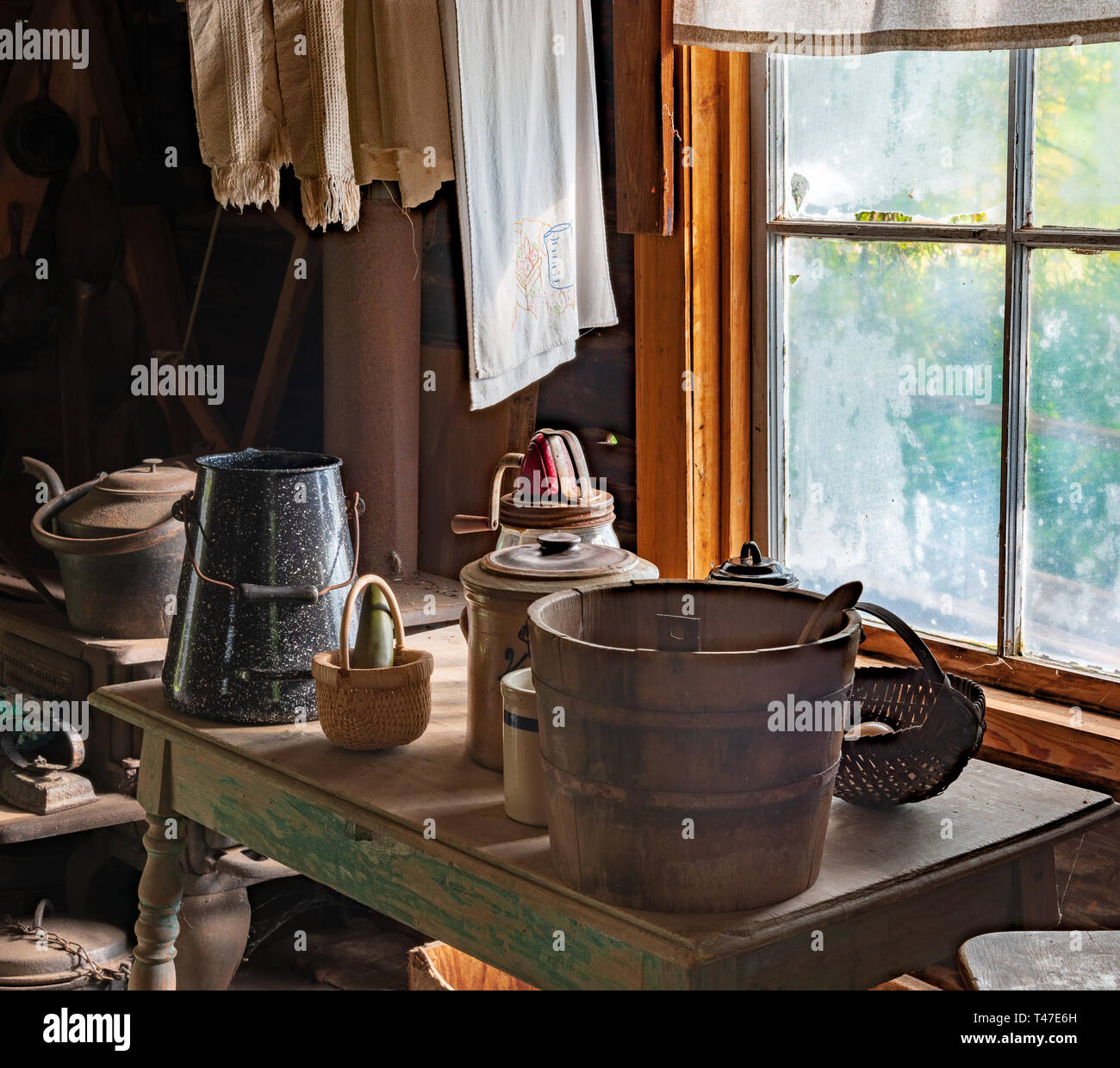Rustic Kitchen with Antique Items by Window Stock Photo - Alamy