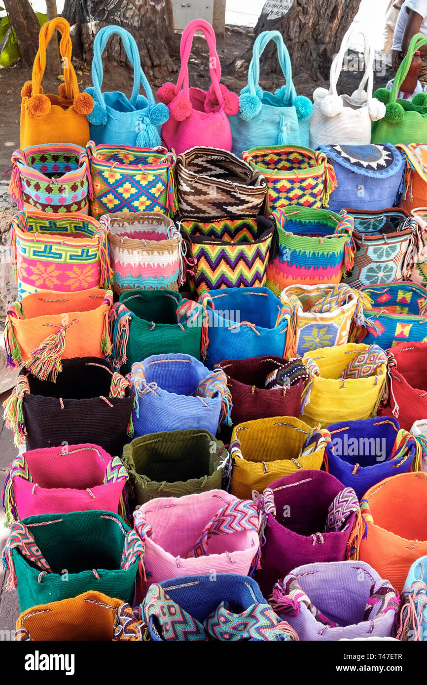 Cartagena Colombia,street vendor,souvenirs,handicraft,handmade mochila Wayuu textile woven handbags,bright colors,display sale,COL190122052 Stock Photo