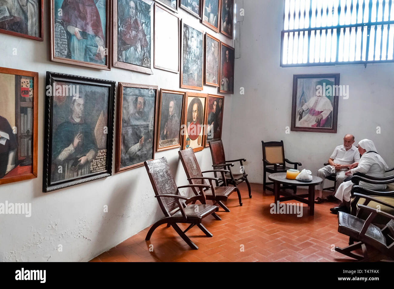 Cartagena Colombia,Hispanic resident,residents,San Pedro Claver Museum & Cloisters,gallery display,religious art,paintings,senior seniors citizen citi Stock Photo