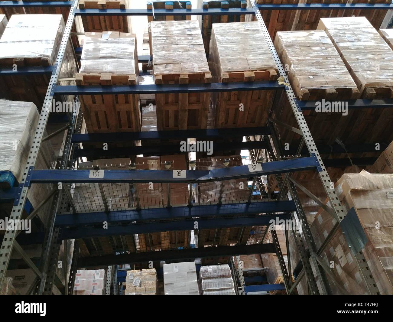 metal shelving with pallets on Stock Photo