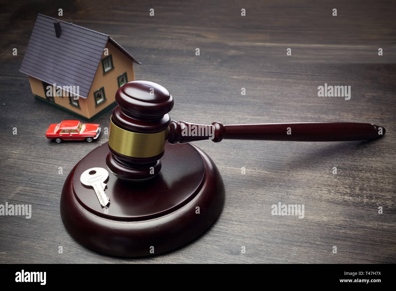 Real Estate Law concept. Model of house and justice gavel. Stock Photo