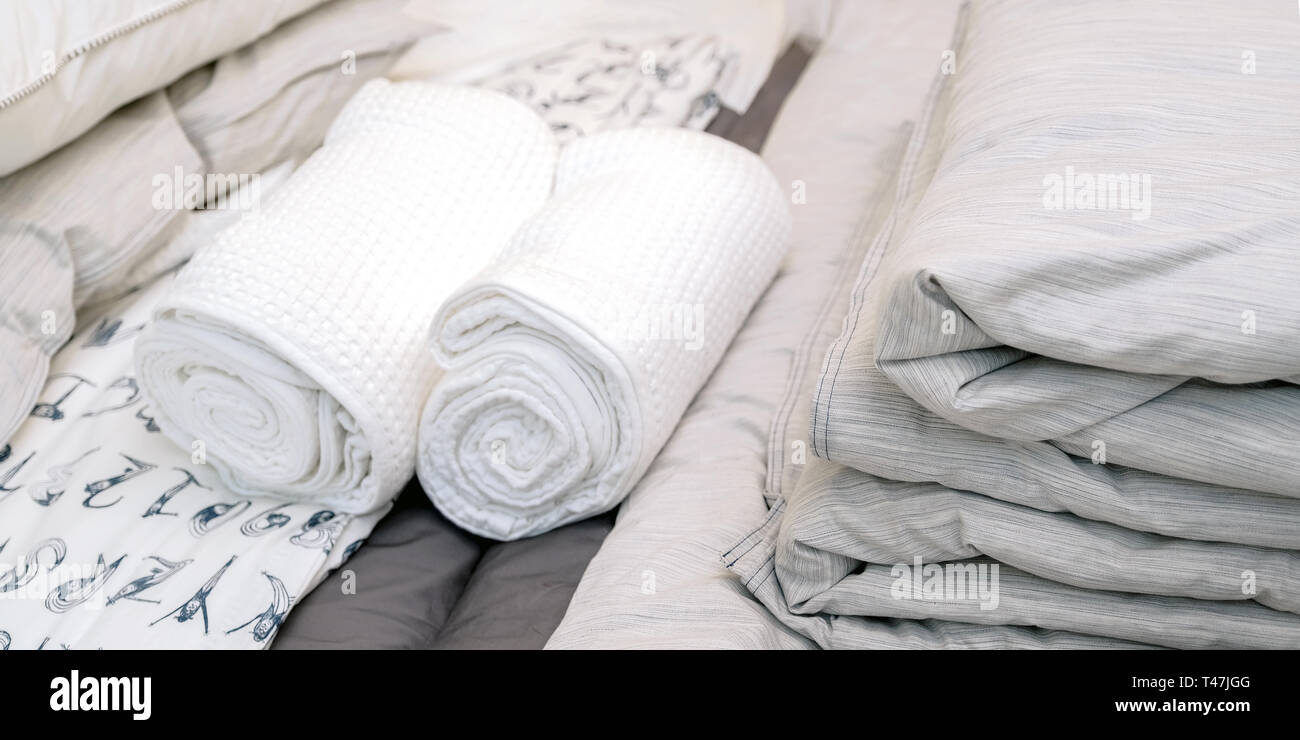 Bed linen and towels at the hotel. Clean towel on bed in modern interior  bedroom Stock Photo - Alamy