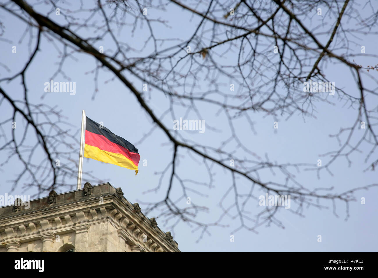 German national flag flying over the restored Reichstag, Berlin, Germany. Stock Photo