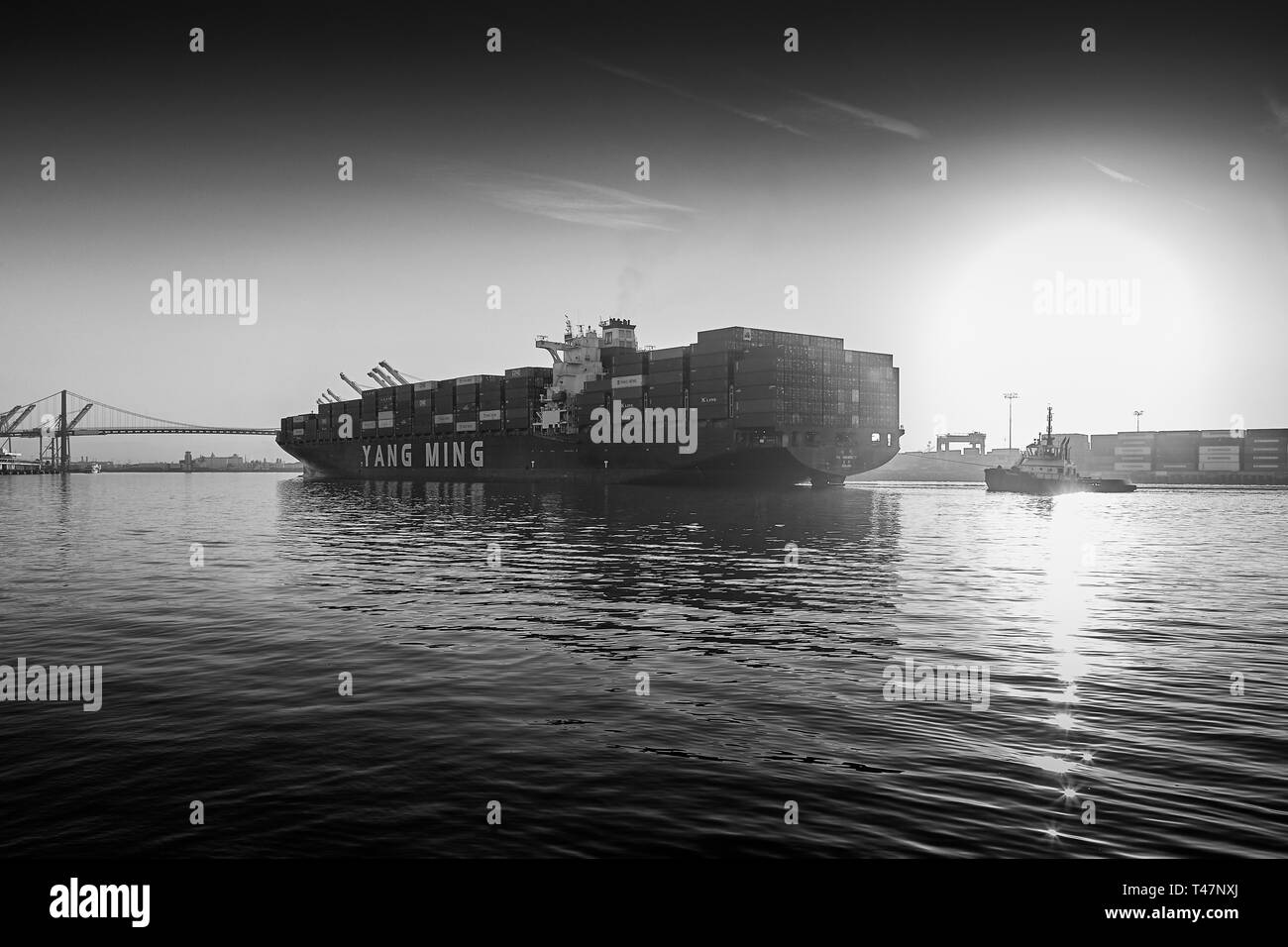 Black And White Photo Of The Container Ship, YM UNANIMITY, In The Los Angeles Main Channel, Bound For The Port Of Los Angeles, California, USA. Stock Photo
