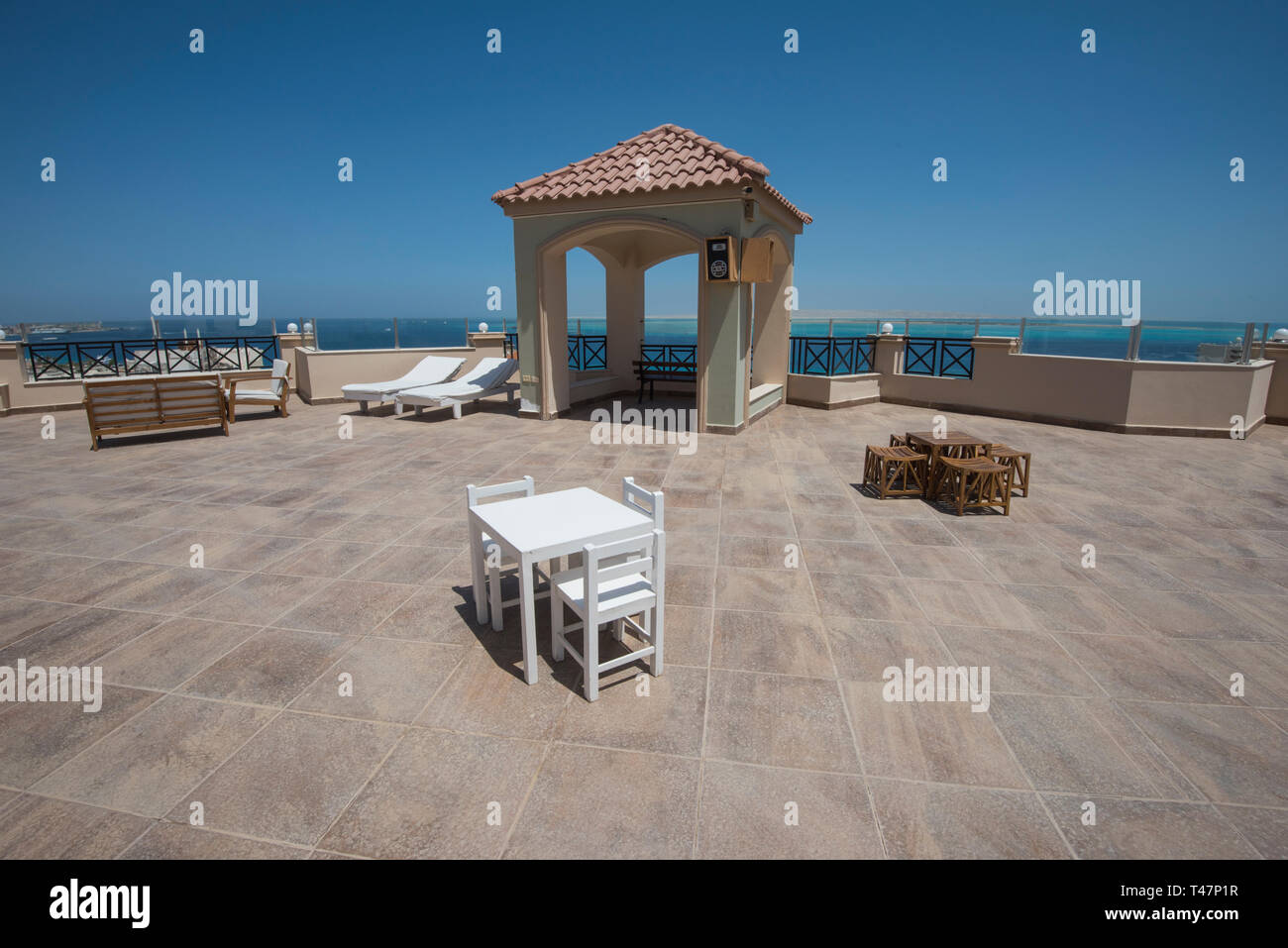Large roof terrace patio area with seating and panoramic tropical sea