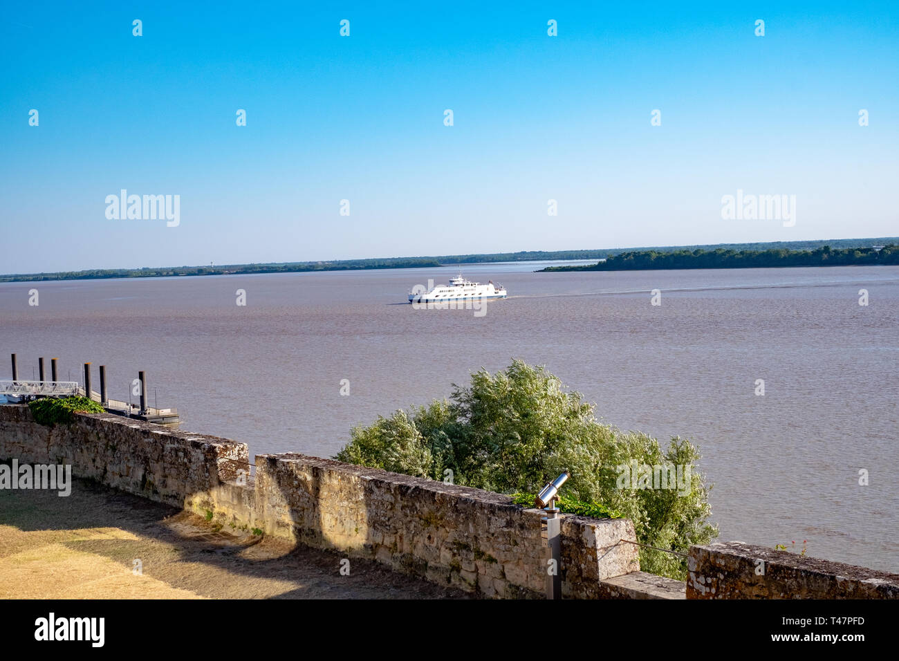 A boat is visible from the promenade at Blay, France Stock Photo
