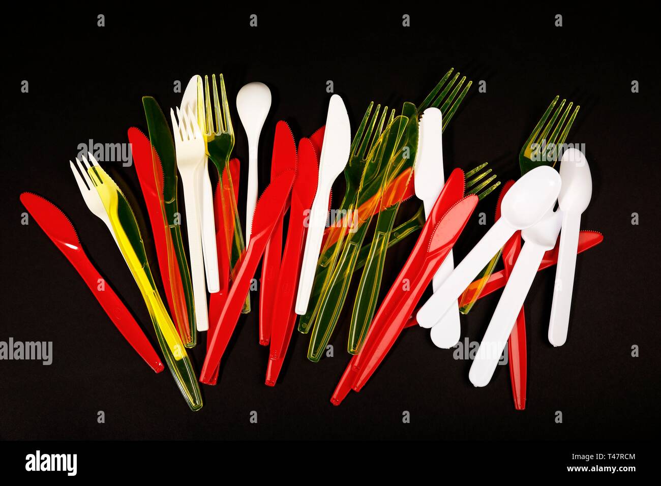 Red, yellow and white plastic cutlery, plastic knives, plastic forks, plastic spoons, plastic waste, Germany Stock Photo