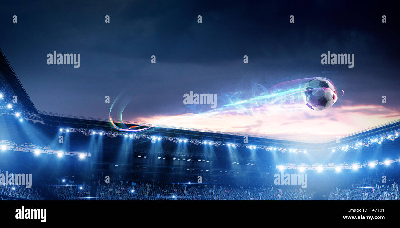 Football stadium background with flying ball Stock Photo