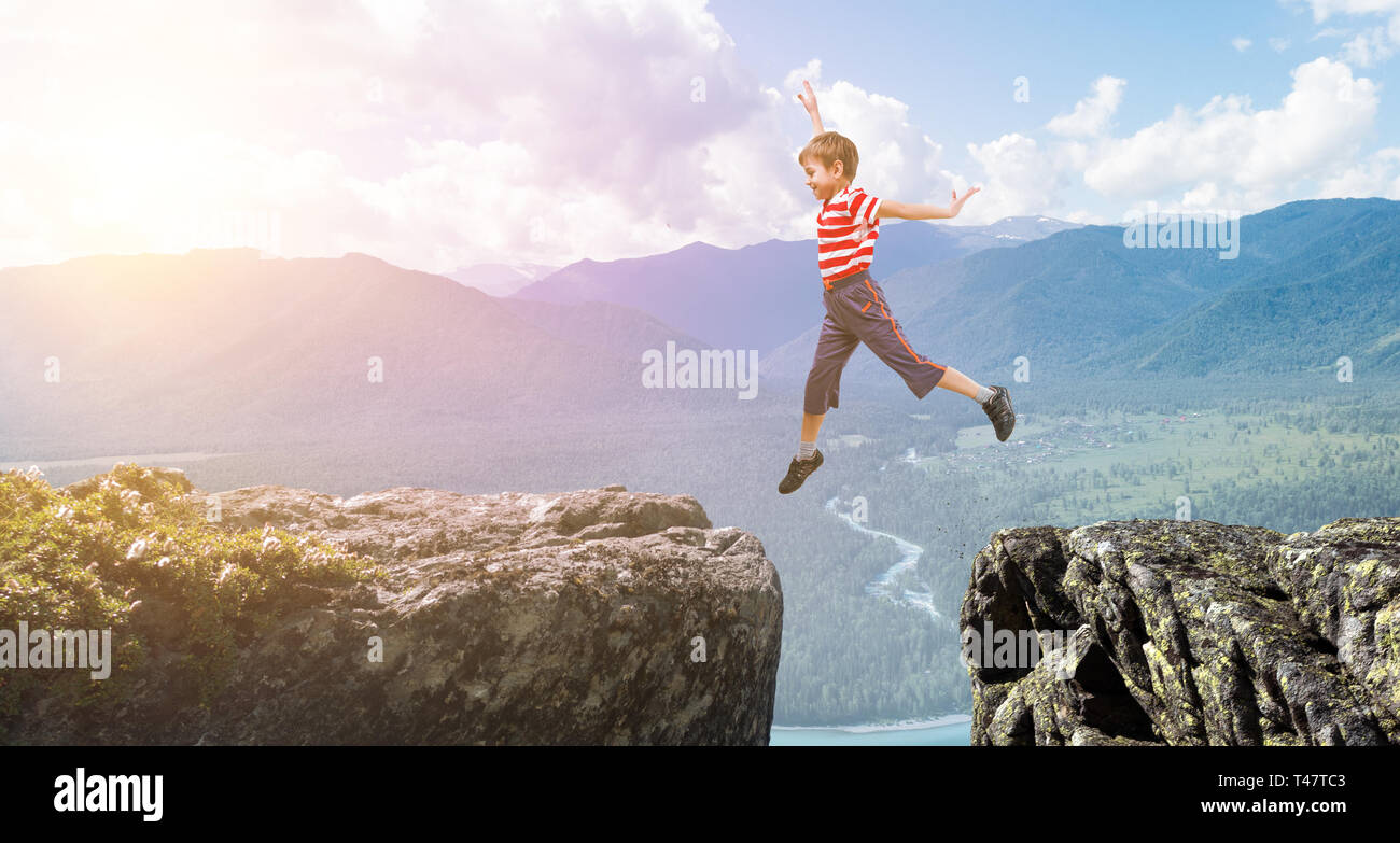 Cute happy little boy jumping. Mixed media Stock Photo