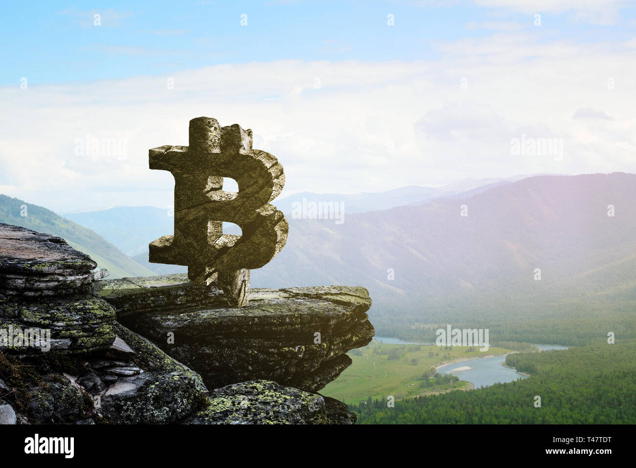 Bitcoin symbol on mountain peak Stock Photo - Alamy