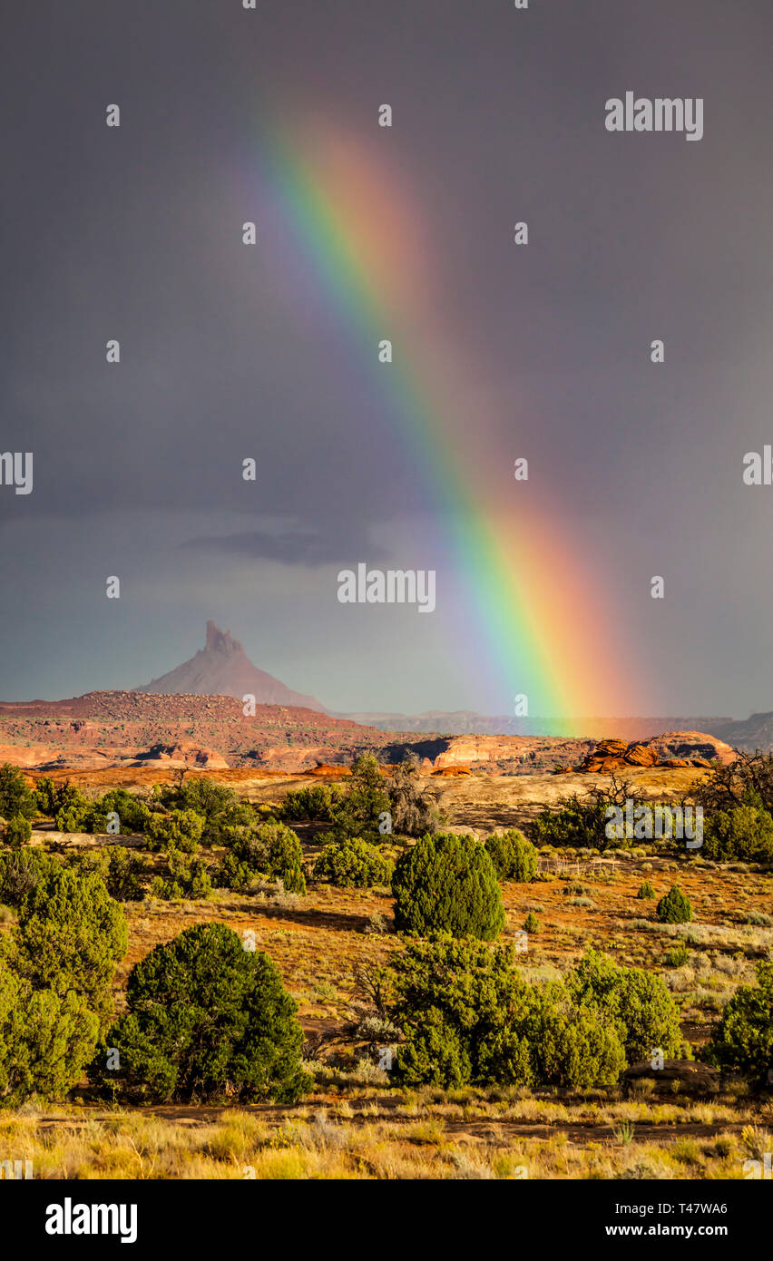A rainbow over South Six-Shooter Peak in South Eastern Utah as seen from Canyonland National Park during a rain storm, USA. Stock Photo