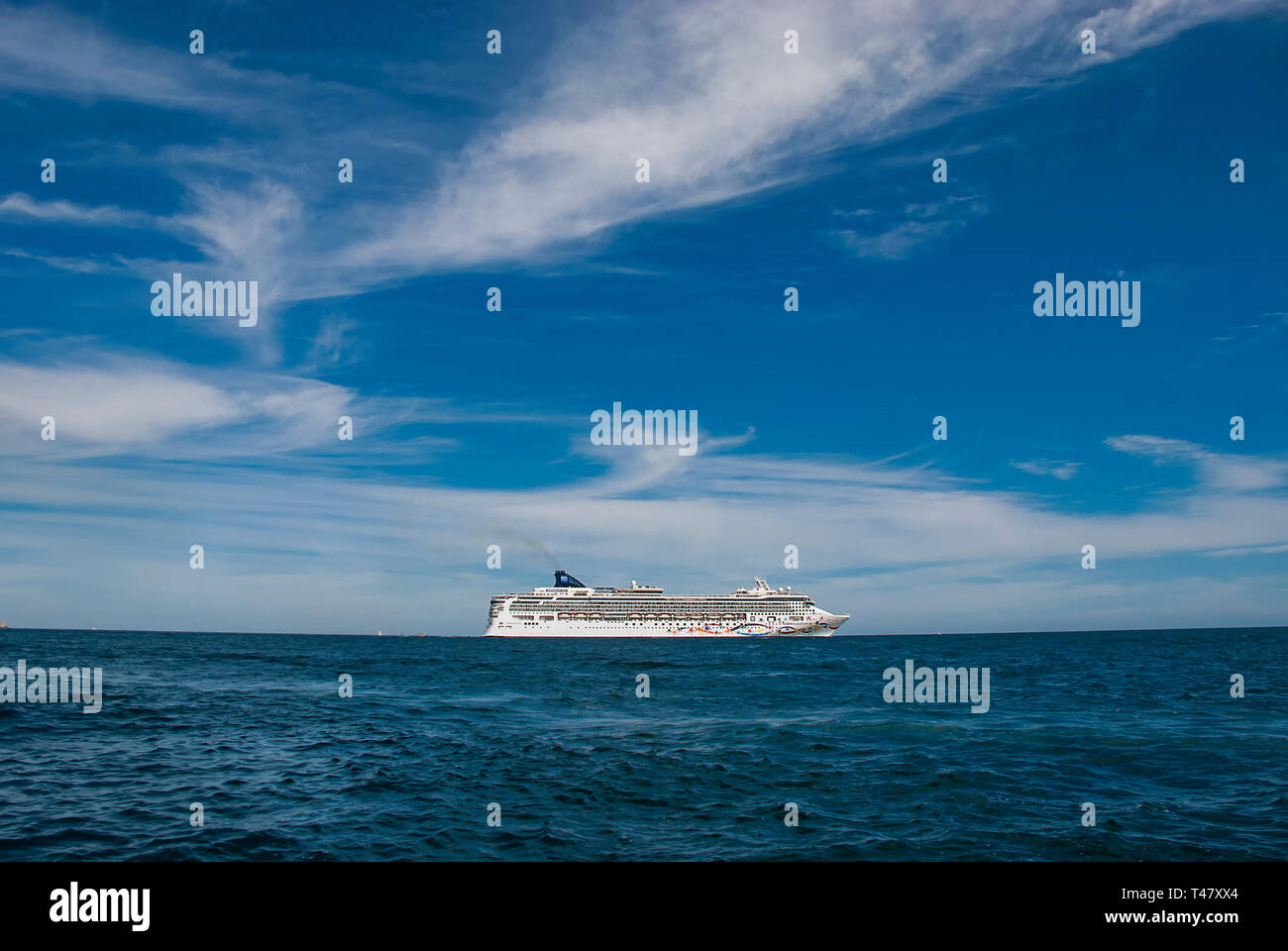 A cruise ship on the horizon in the Pacific Ocean Stock Photo