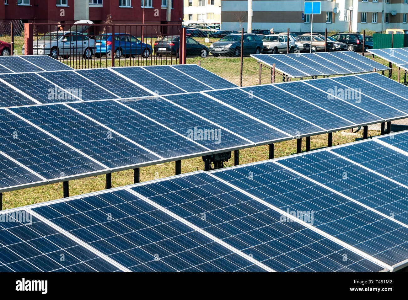 Solar panels near residential quarter of the city. Renewable solar energy Stock Photo Alamy
