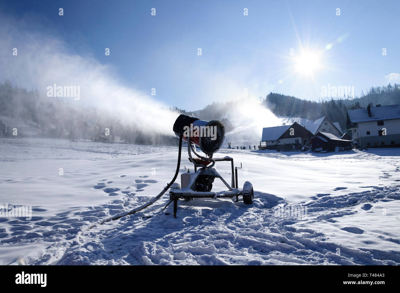 https://c8.alamy.com/comp/T484A3/landscape-of-a-mountain-ski-resort-where-slope-are-prepare-by-snowmaking-machine-with-artificial-white-snow-footsteps-in-deep-snow-cover-mountain-a-T484A3.jpg