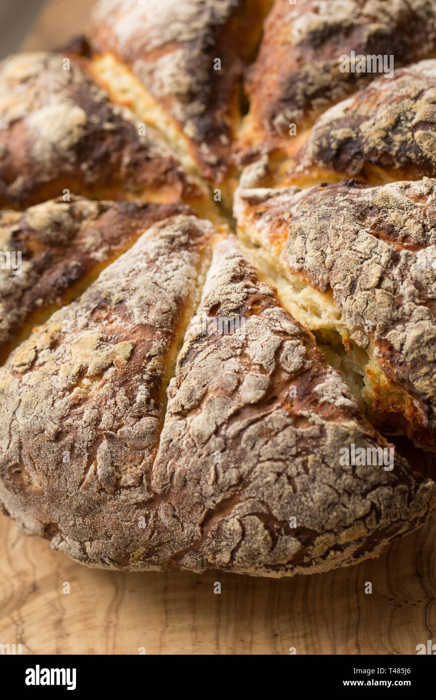Home cooked soda bread that has been made with olive oil, salt, baking