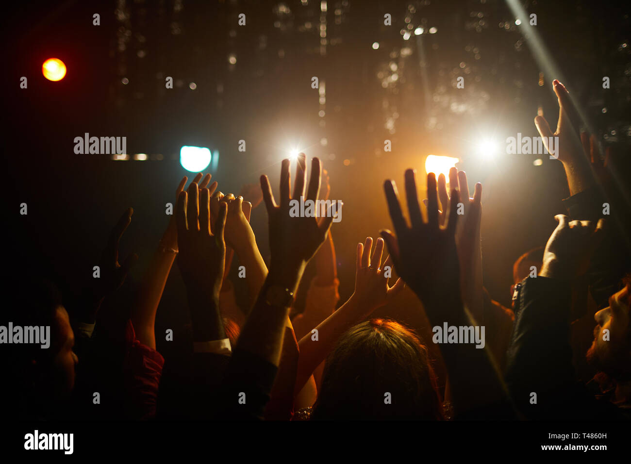 People waving hands at concert Stock Photo Alamy