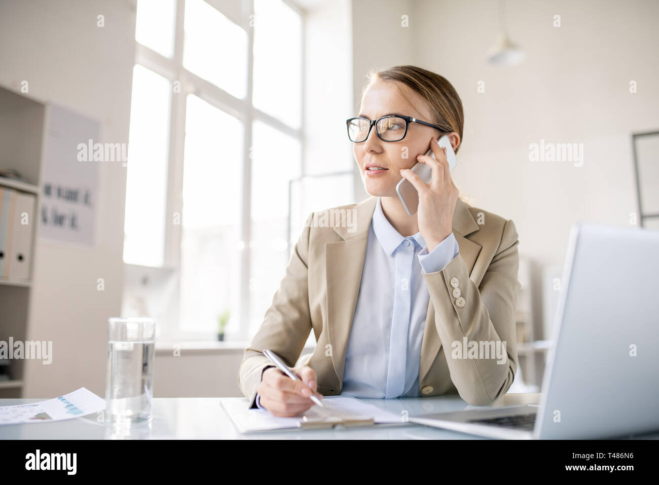 Inspired business lady talking on phone Stock Photo