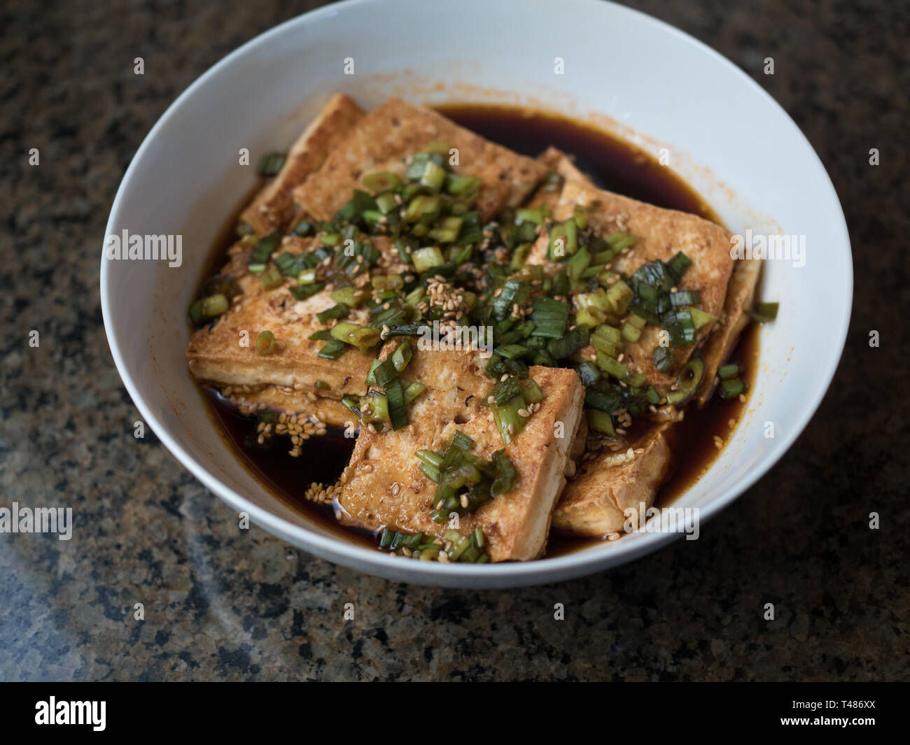 Tofu marinated in soy sauce Stock Photo - Alamy